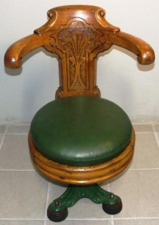 Numbered swivel-chair in mahogany with cast-metal base. Leather seat. Late 19th century.